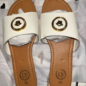 Women's White Slide Sandals with Gold Medallion